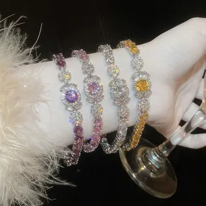 Luxurious zircon flower bracelets in four vibrant colors worn with elegant evening wear