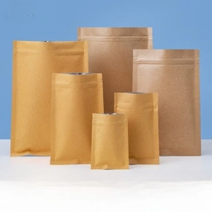 Detail view of brown kraft paper stand-up pouches with zip lock and U-shaped tear notch