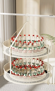 Close-up of double-layer folding drying rack showing heavy-duty load capacity with water bottles
