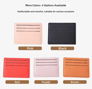 Flat lay of ultra-slim leather card holders in pink, black, red, purple and brown