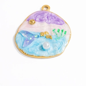 Detail of 18k gold plated sea shell pendant with gradient resin and faux pearls