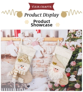 Detail of Santa and Snowman stockings with gold accents on a cozy fireplace mantle
