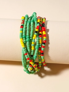 Detailed macro view of bohemian handmade colorful beaded waist chain with tropical patterns