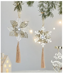 Exquisite gold metal snowflake and star ornaments with tassels on a Christmas tree