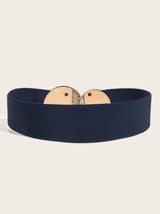 Detail of navy blue elastic corset belt with gold metal buckle and beige leather trim