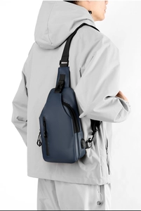 Detail of dark blue waterproof chest bag with integrated external USB charging port