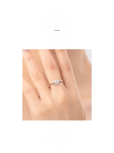Detail of s925 silver crown ring with a round brilliant cut stone on a model hand