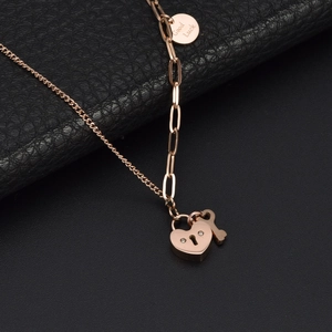 18k gold heart lock necklace with asymmetric pearl chain and Good Luck engraved tag