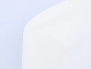 Close-up of the premium white fabric texture and clean stitching of the vest set