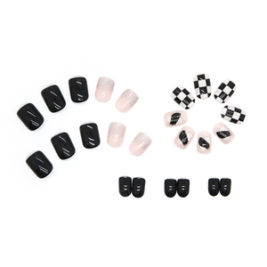 Short square press-on nails featuring black checkerboard patterns and glitter gradients
