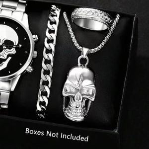 Silver skull jewelry set featuring a metallic watch, Cuban chain, necklace and ring