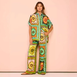 Summer casual two-piece set featuring short sleeve floral shirt and wide-leg trousers