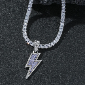 Detail of silver lightning pendant with purple and blue crystals on tennis chain