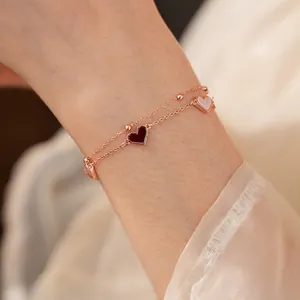 Bracelet double chaîne vintage doré rose avec nacre et pendentifs en forme de cœur