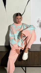 Detail of oversized knit sweater set with pink orange and mint green rabbit jacquard texture