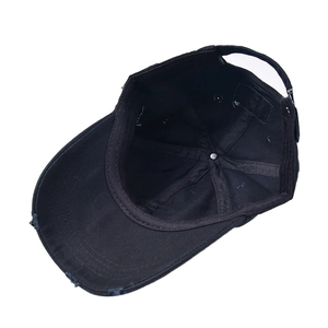 Black distressed cotton baseball cap with ripped brim detail and adjustable back strap