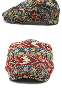Close-up of jacquard patterned beret hat featuring ethnic motifs and metal side buckle
