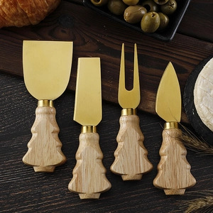 Detailed view of 4-piece stainless steel cheese knives with Christmas tree wooden handles