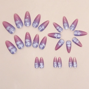 Pink and purple gradient almond press-on nails with dreamy white cloud patterns