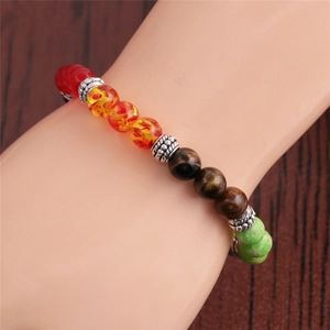 Colorful agate beaded bracelet for women with silver spacers on a model wrist