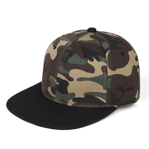 Detail of adult hip hop cap showing camouflage crown and black flat brim stitching