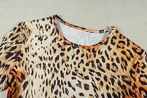 Detail of a round neckline on a stretchy leopard print dress with high-quality stitching