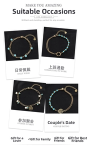 Detail of vintage gold bracelets with turquoise beads, pearls and tree of life charms