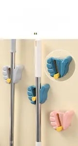 Detail showing waterproof wall mounted mop holder with strong non-slip grip mechanism