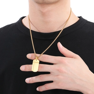 Men's gold-tone stainless steel dog tag necklace with cross crack design on model