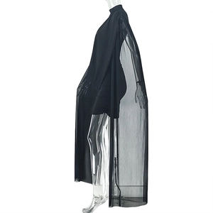 Detail of black slim fit mini dress with sheer long mesh shawl on a ghost mannequin