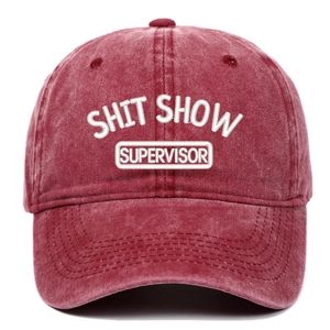 Vintage washed burgundy baseball cap with white embroidered text on white background