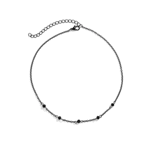 Detail of gothic black choker featuring faceted beads and an adjustable lobster clasp