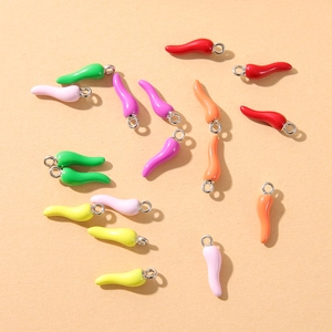Flat lay of colorful enamel chili pepper alloy charms for DIY earring and jewelry making