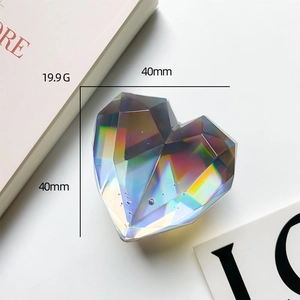 Detail view of a 40mm heart-shaped iridescent phone grip with faceted crystal texture