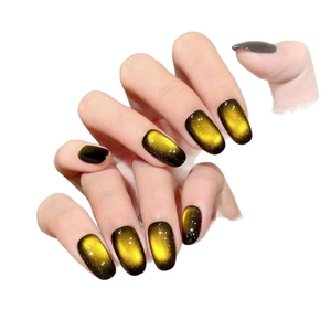 Handmade amber starburst cat eye press-on nails with golden gradient effect