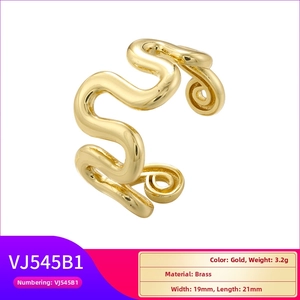 Detailed view of gold wavy spiral brass ring with 3.2g weight and 21mm outer diameter