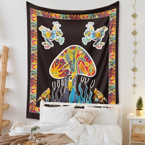 Detail of bohemian mushroom tapestry with psychedelic colors on black fabric for bedroom