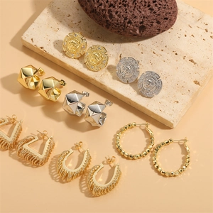Retro lion head and geometric hoop earrings set in polished gold and silver finishes