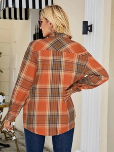 Back view of a casual long-sleeve orange plaid shirt with soft flannel texture for women