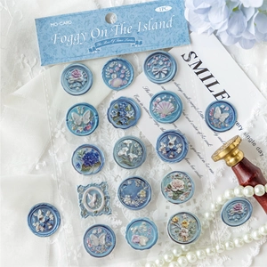 Vintage blue wax seal stickers with 3D embossed floral patterns and butterfly motifs