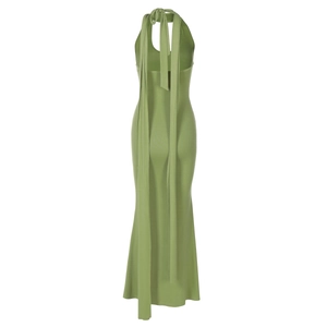Detailed back view of light green halter dress showing open back and tie-up neck design