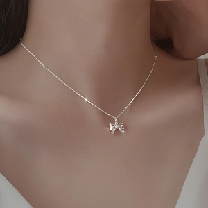 Elegant S925 sterling silver bow necklace with shimmering pendant for women