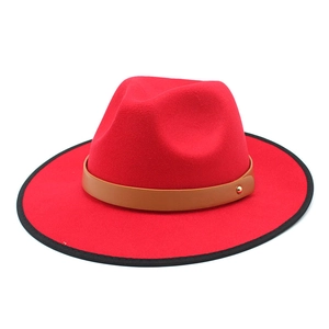 Red wool fedora hat with a brown leather strap and stylish black bound edge for women