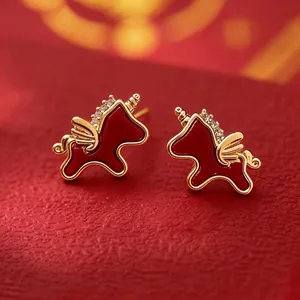 Red enamel unicorn stud earrings with gold plating and sparkling zircon accents