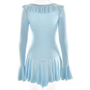 Detail of light blue dress showing tiered ruffle hem and soft flowing fabric texture