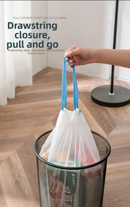 Detail showing the blue drawstring closure on a sturdy white kitchen trash bag in use