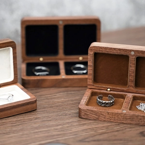 Detail of walnut wood jewelry box featuring magnetic closure and soft velvet lining