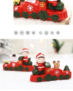 Detail of Christmas resin train with reindeer and santa figures in a snow scene