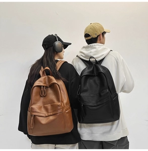 Detail showing high-quality brown and black soft leather texture of large backpacks