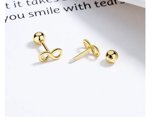 Detail of gold infinity stud earrings with S925 hallmark and secure screw-back ball closures